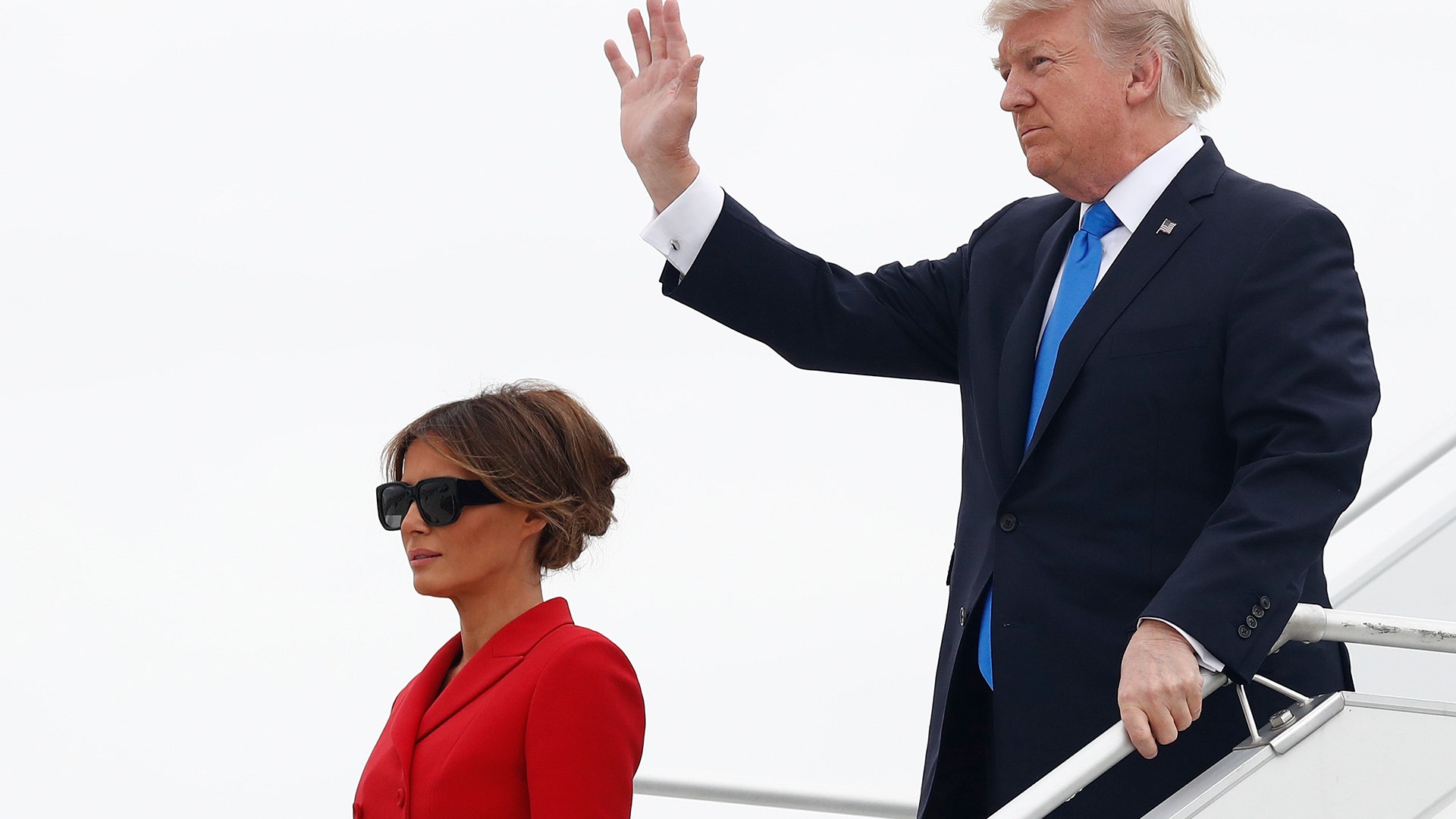 President Donald Trump and first lady Melania Trump arrive on Air Force One at Orly Airport in Paris
