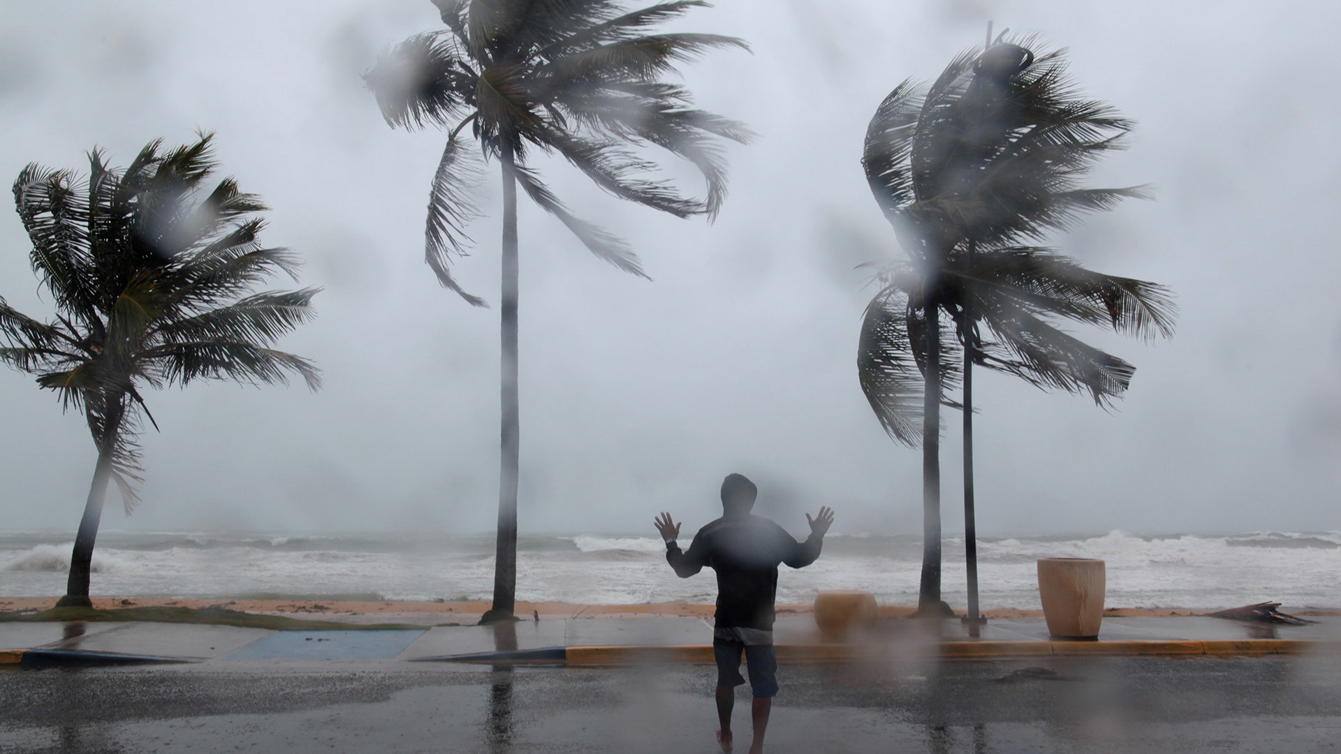 A man in the winds and rain as Hurricane Irma slammed across islands in the northern Caribbean on Wednesday, in Luquillo, Puerto Rico