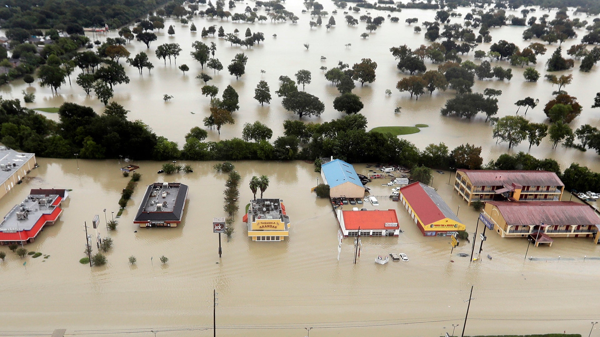 Water from Addicks Reservoir flows into neighborhoods as floodwaters from Tropical Storm Harvey rise in Houston, August 29, 2017