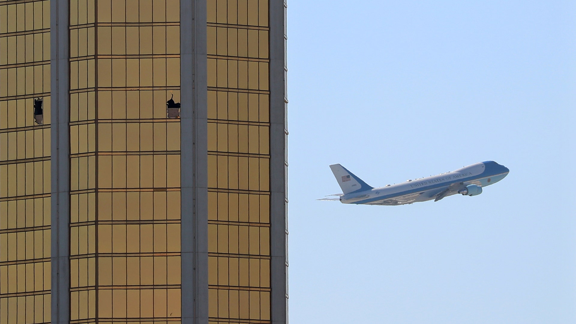 Air Force One flies past the broken windows Stephen Paddock used to shoot from at the Mandalay Bay hotel, in Las Vegas, October 4