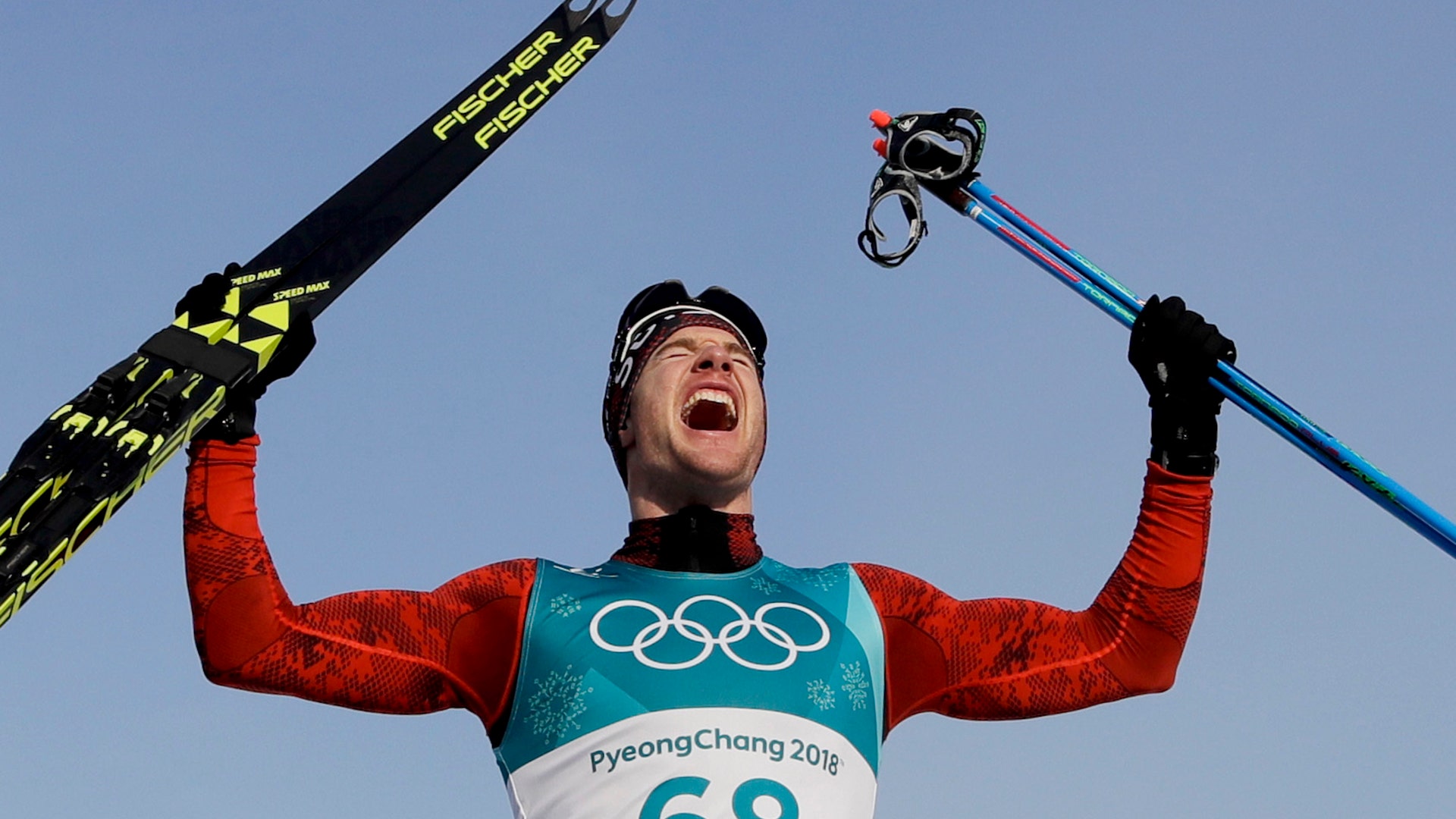 Dario Cologna, of Switzerland, after winning the gold medal in the men's 15km freestyle cross-country ski race at the 2018 Winter Olympics