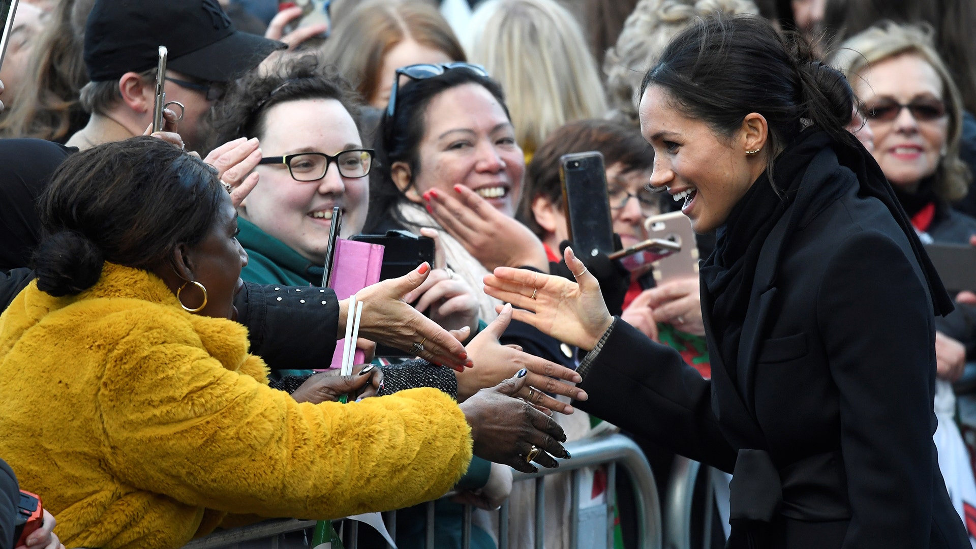 Crowds greet Britain's Prince Harry's fiancee Meghan Markle during a visit to Cardiff Castle in Cardiff, Britain, January 18, 2018