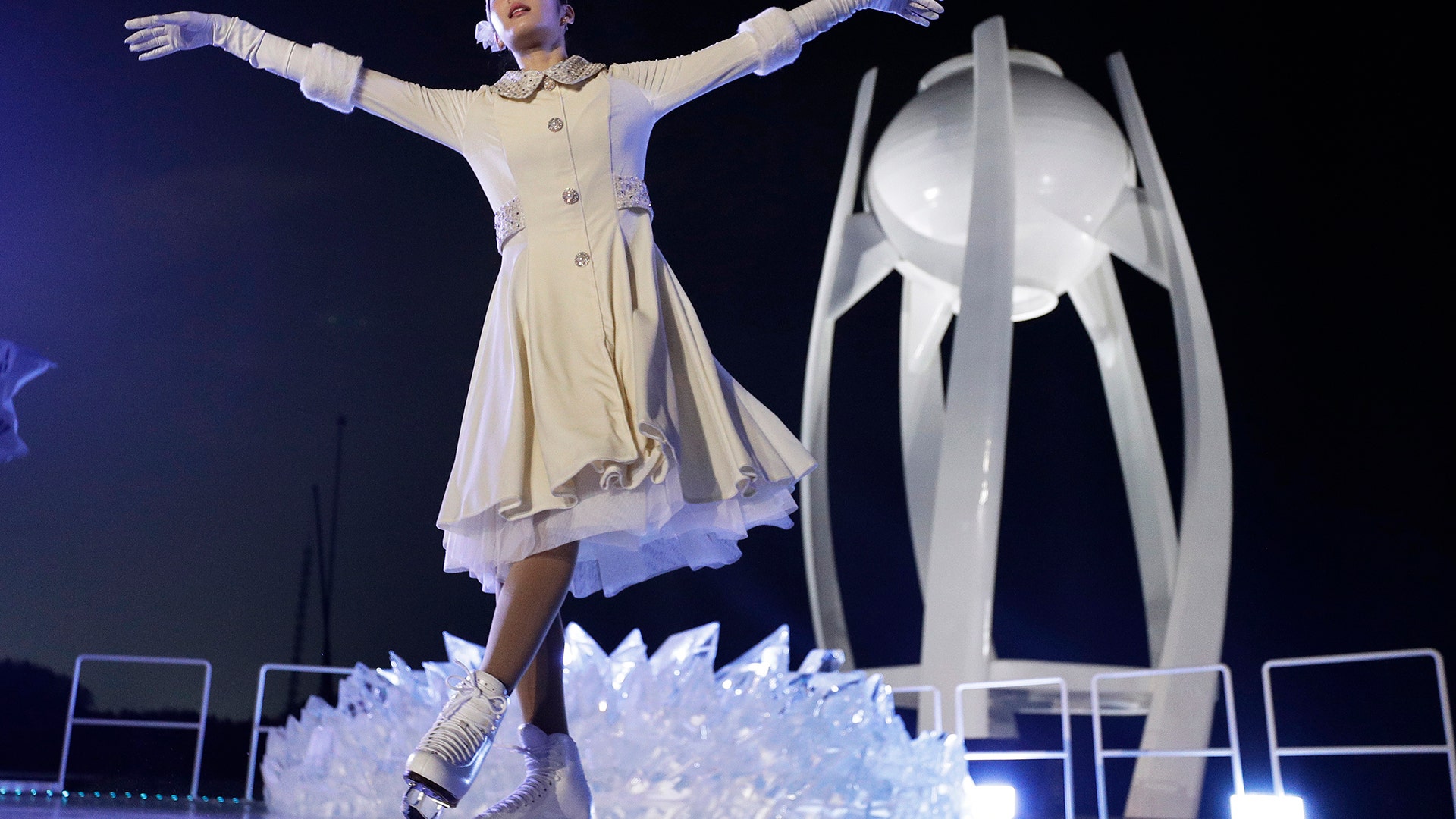 South Korean Olympic figure skating champion Yuna Kim performs before lighting the Olympic flame in Pyeongchang