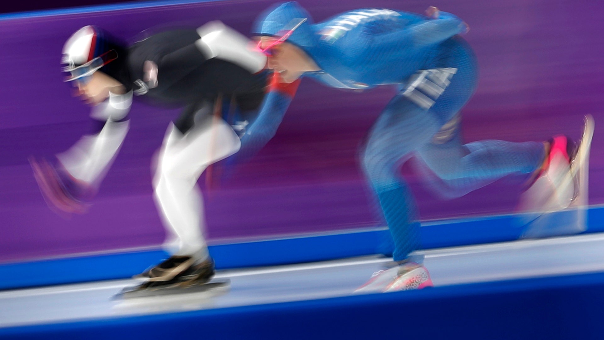 Mia Manganello of the United States, left, and Francesca Lollobrigida of Italy  during the women's 1,500 meters speedskating race