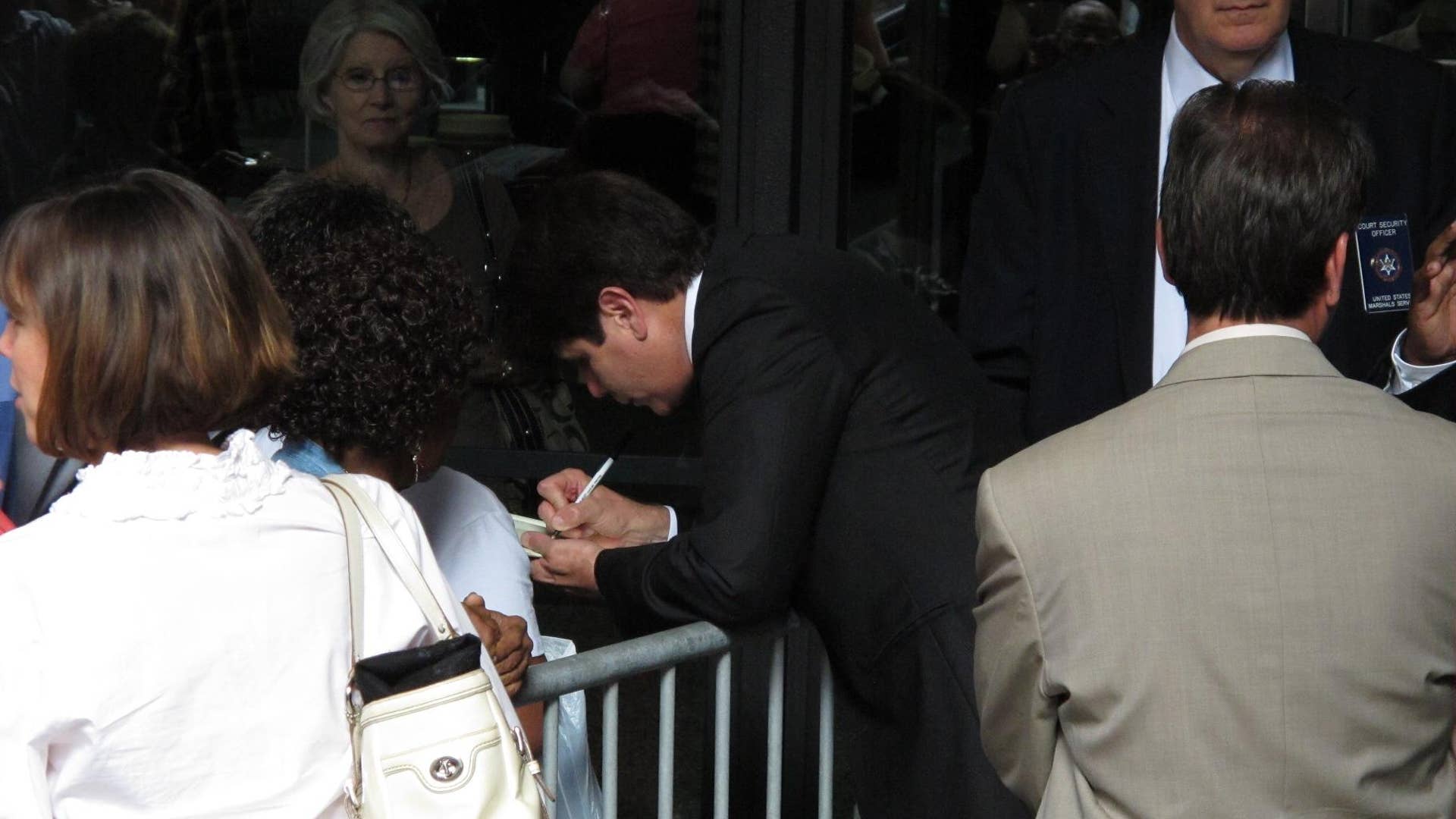 Blagojevich Signs Autograph