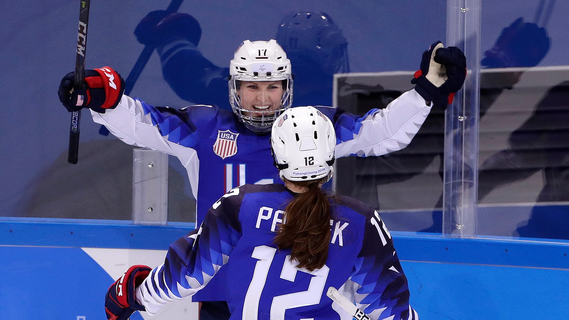 Jocelyne Lamoureux-Davidson of the United States celebrates her second goal against the team from Russia with teammate Kelly Pannek