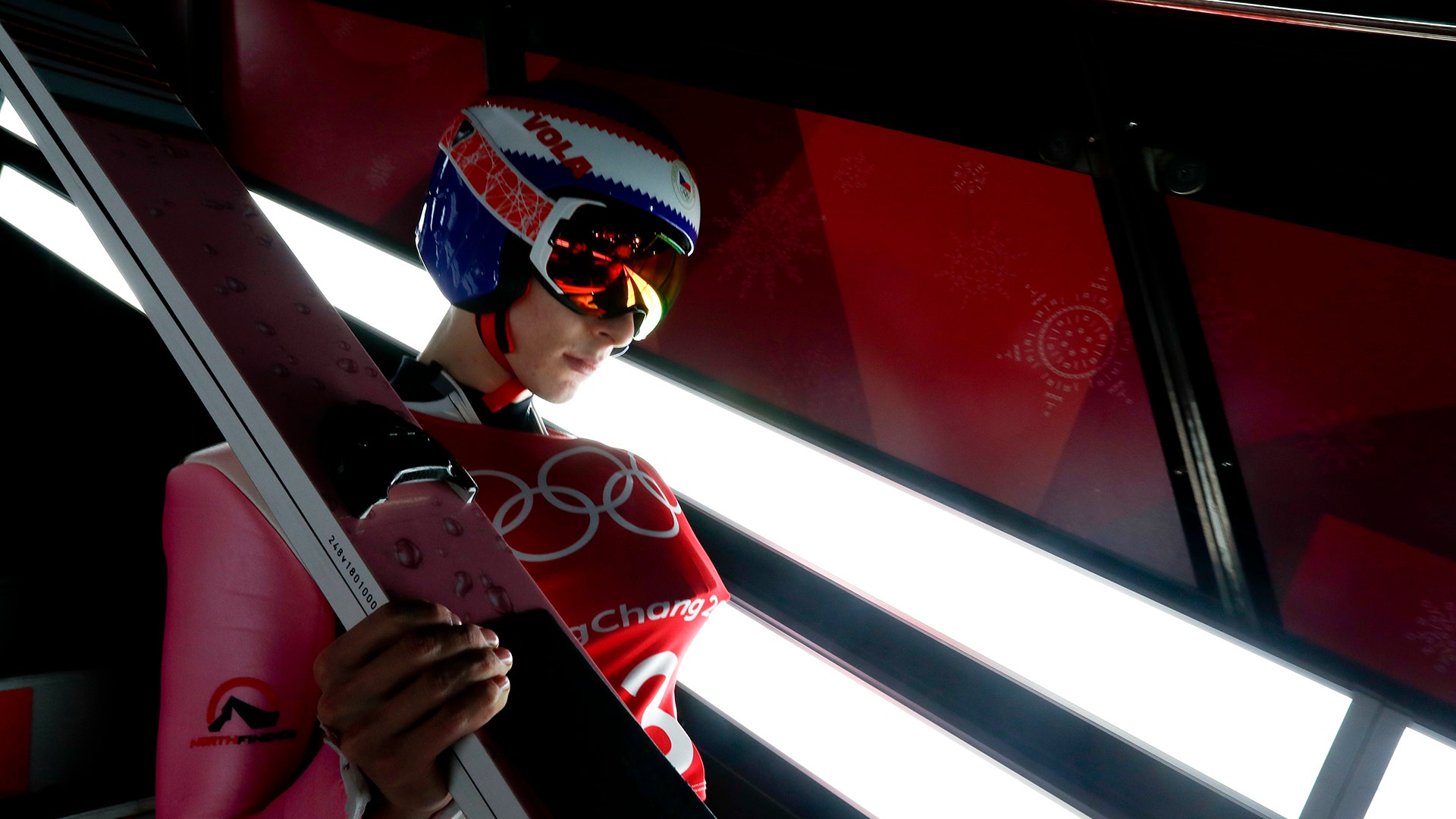 Viktor Polasek of the Czech Republic, waits to jump during training for the men's large hill individual ski jumping event at the Winter Olympics
