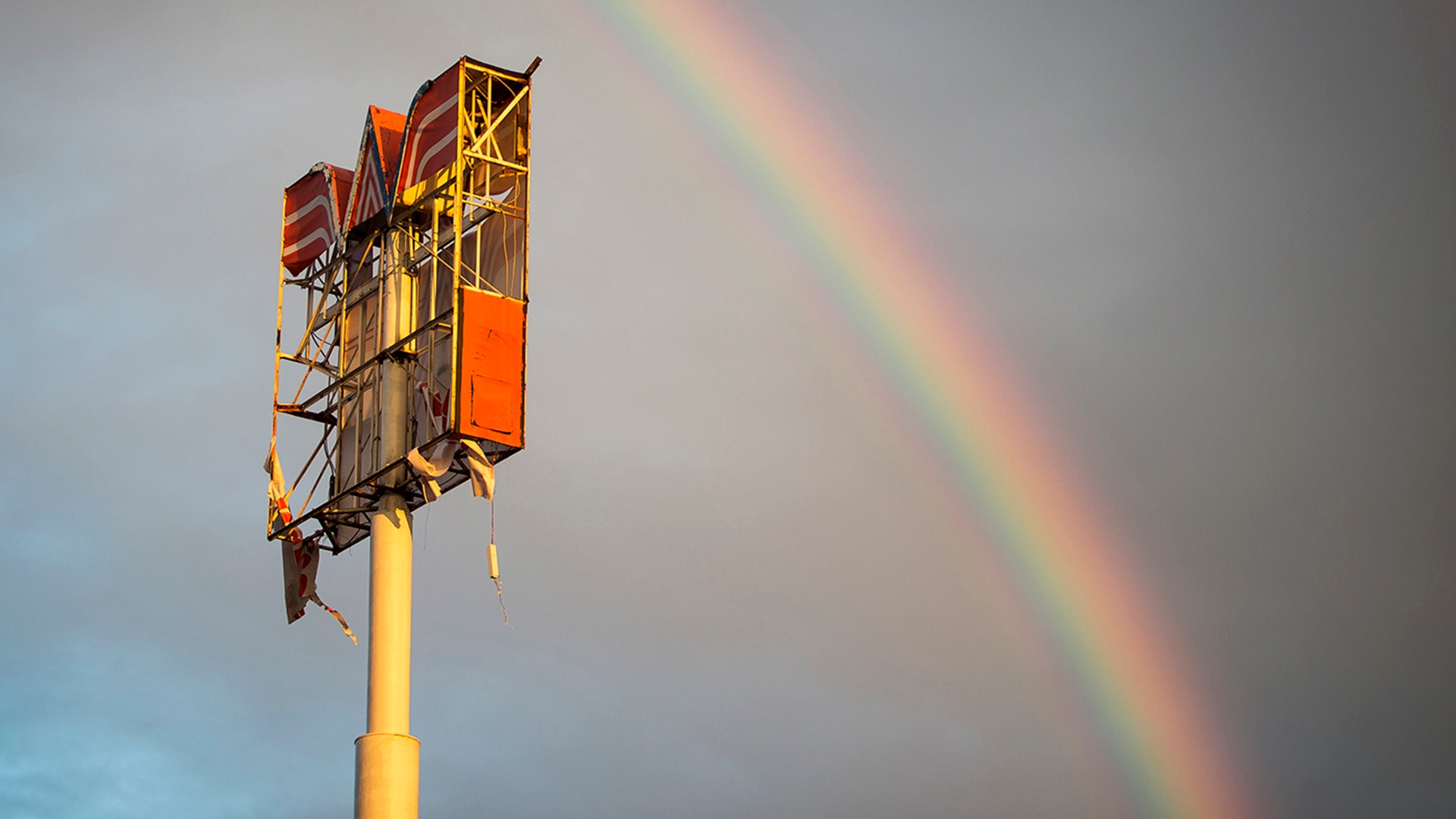 A rainbow appears over over a Whataburger sign that was destroyed by Hurricane Harvey in Refugio, Texas, Monday