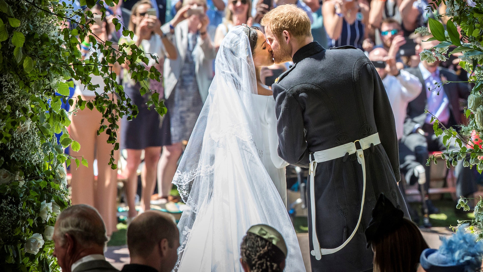 Meghan Markle and Prince Harry kiss on the steps of St George's Chapel at Windsor Castle following their wedding