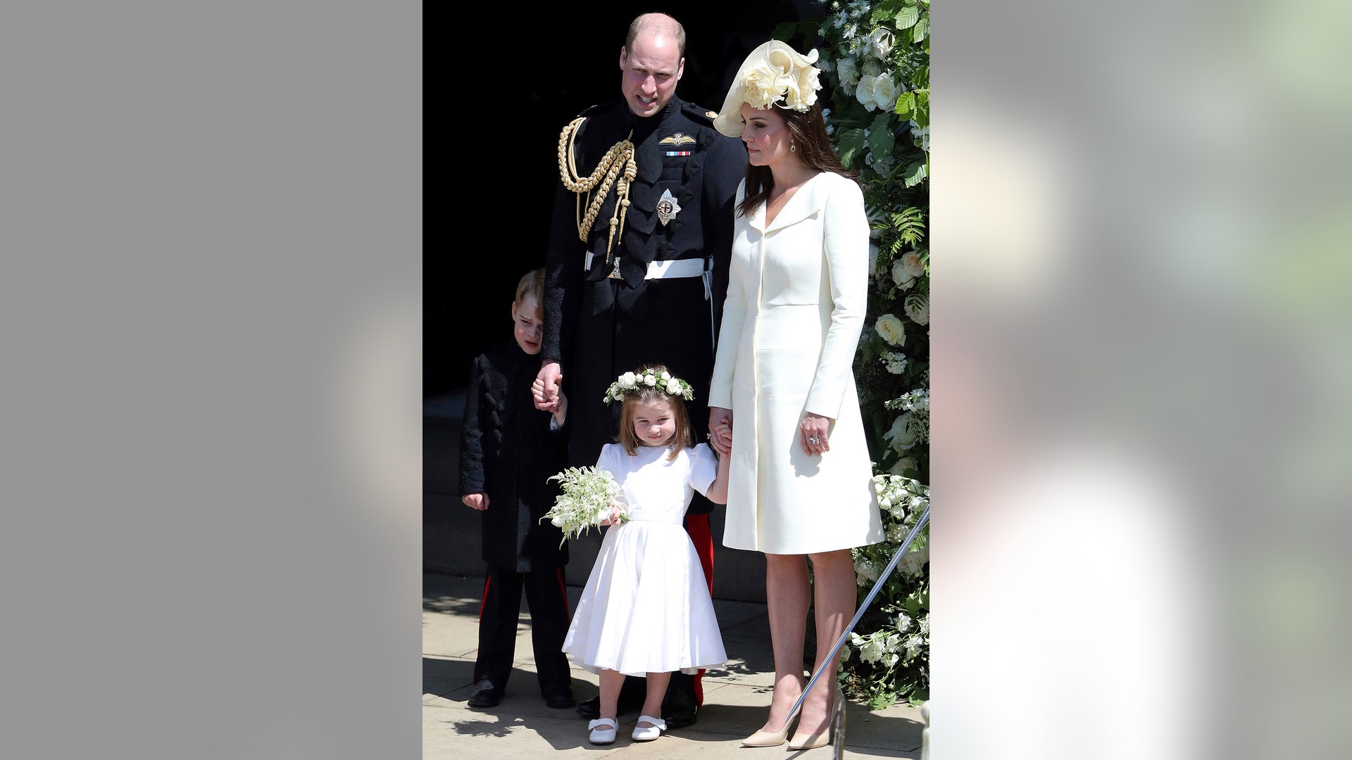 Prince William and Kate, Duchess of Cambridge with Prince George and Princess Charlotte leave after the wedding ceremony