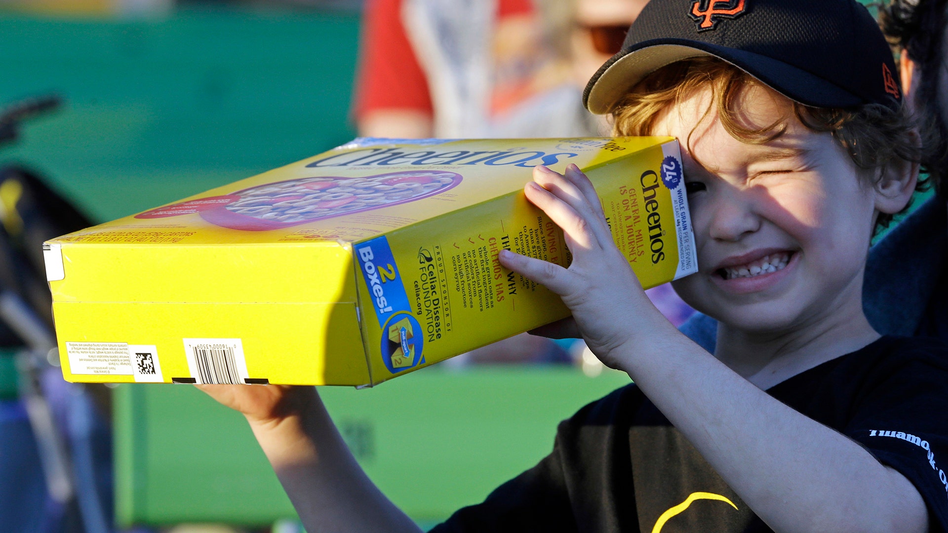 Griffin O'Roak watches the rising sun with his homemade eclipse viewer at a gathering of eclipse viewers in Salem, Oregon