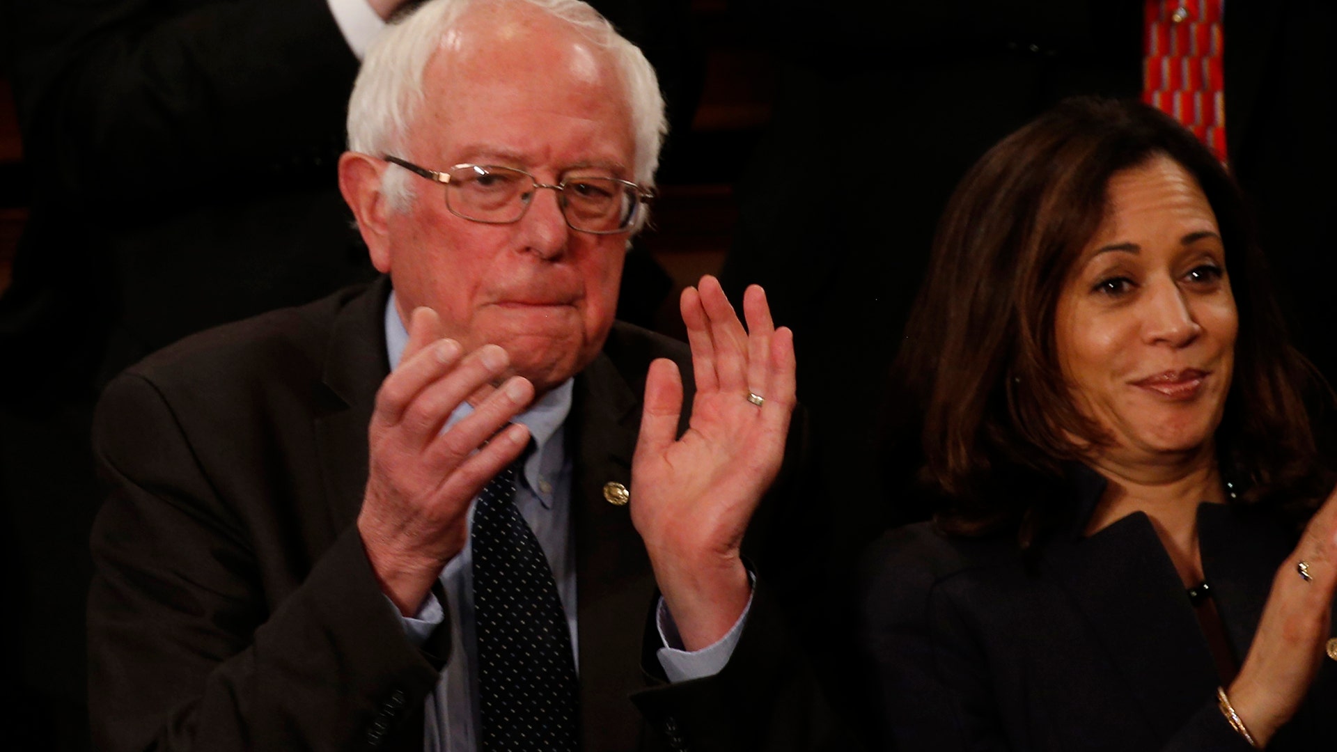 Sen. Bernie Sanders, a one-time presidential candidate, applauds as the president addresses Congress. 