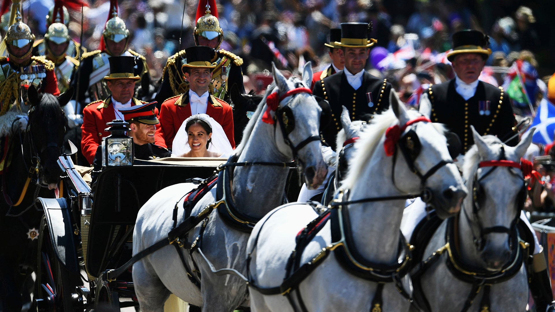 Meghan Markle with her husband Prince Harry in a horse-drawn carriage after their wedding ceremony