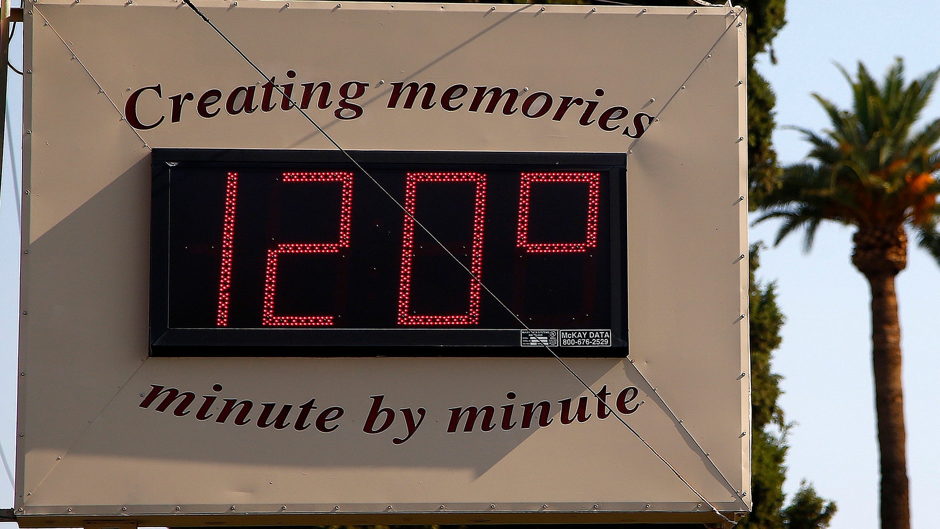 A temperature sign reads 120 degrees as temperatures climb to near-record highs in Phoenix, Tuesday