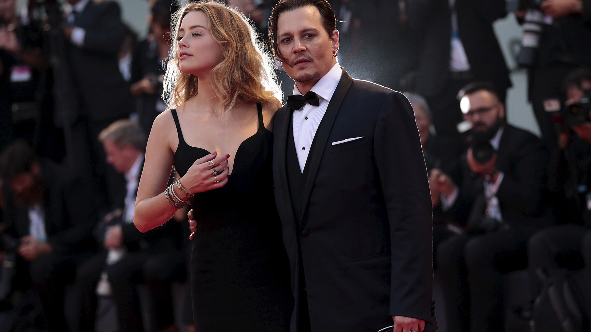 With his former wife, Amber Heard, who he divorced in 2016, at the 72nd Venice Film Festival in Italy, September 4, 2015