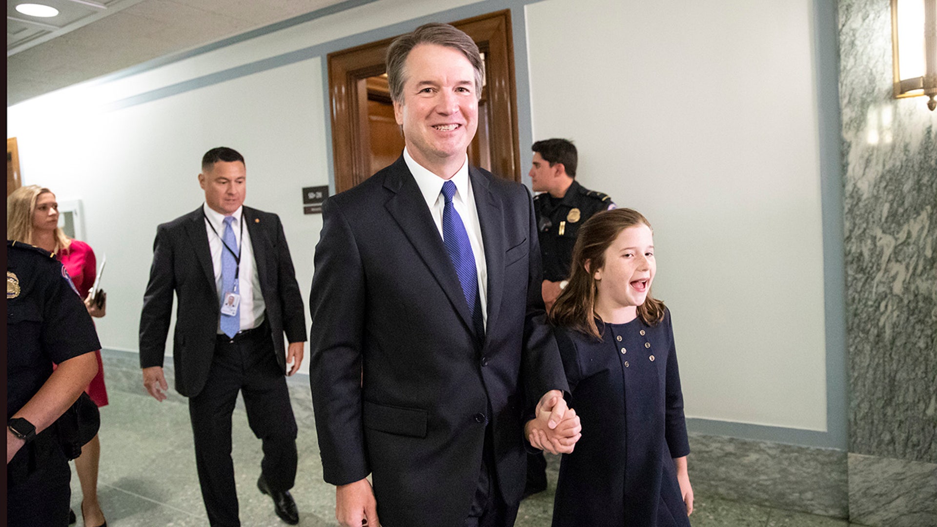 Supreme Court nominee, Brett Kavanaugh, with daughter Liza, departs his Senate Judiciary Committee confirmation hearing on Capitol Hill 