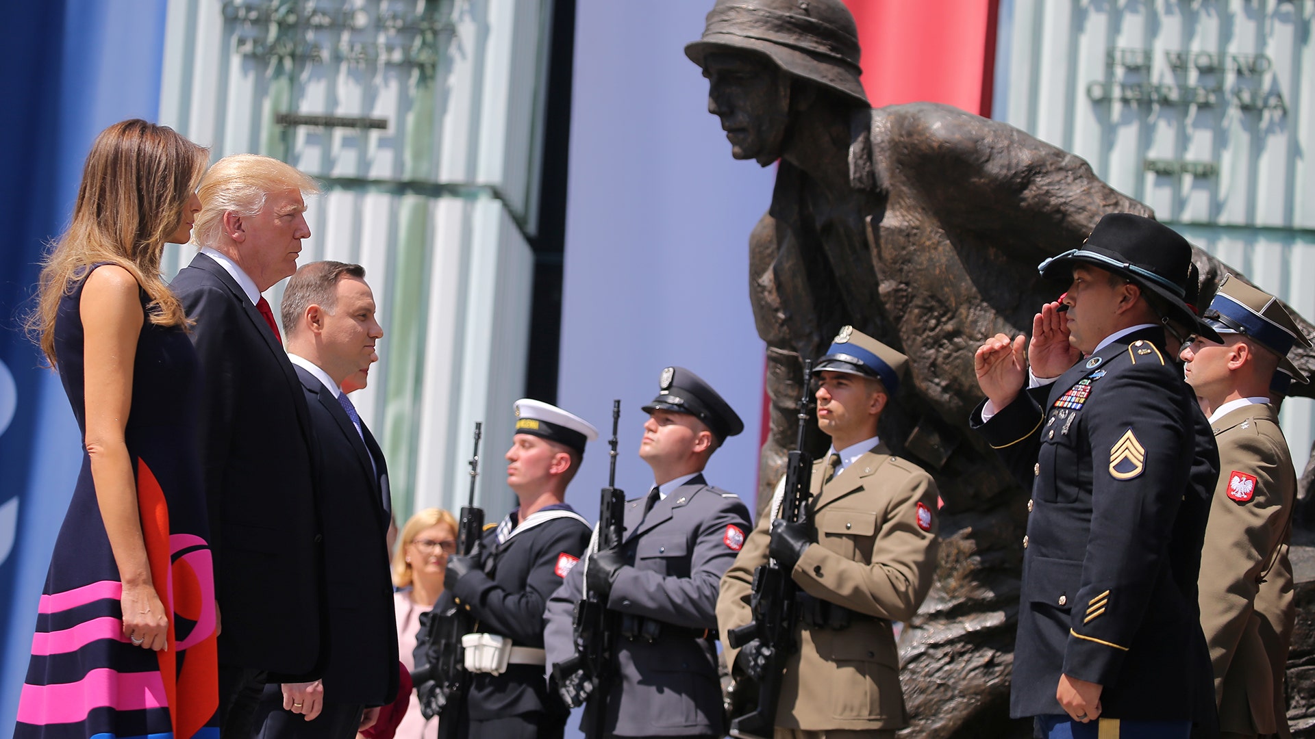 President Donald Trump, First Lady Melania Trump and Polish President Andrzej Duda at the Warsaw Uprising Monument in Krasinski Square