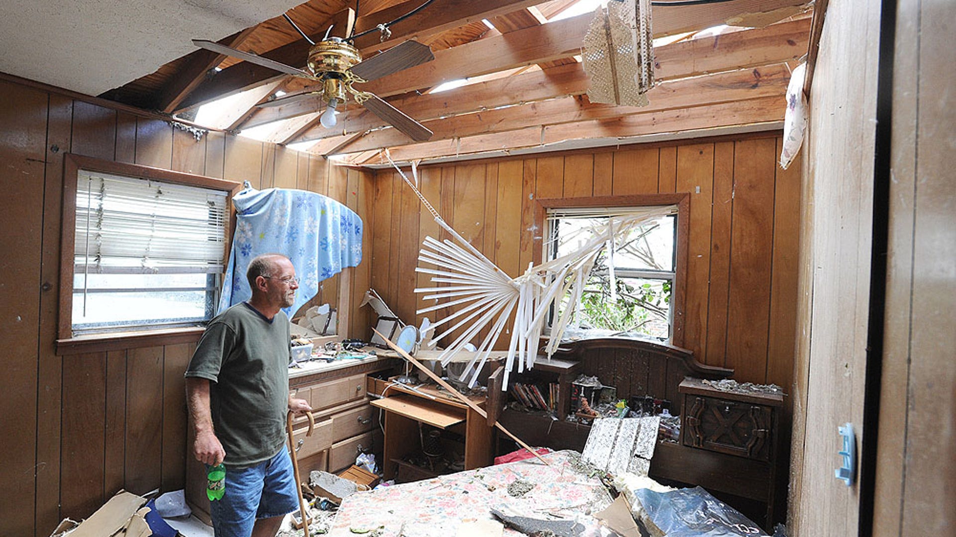 Man_in_Damaged_House