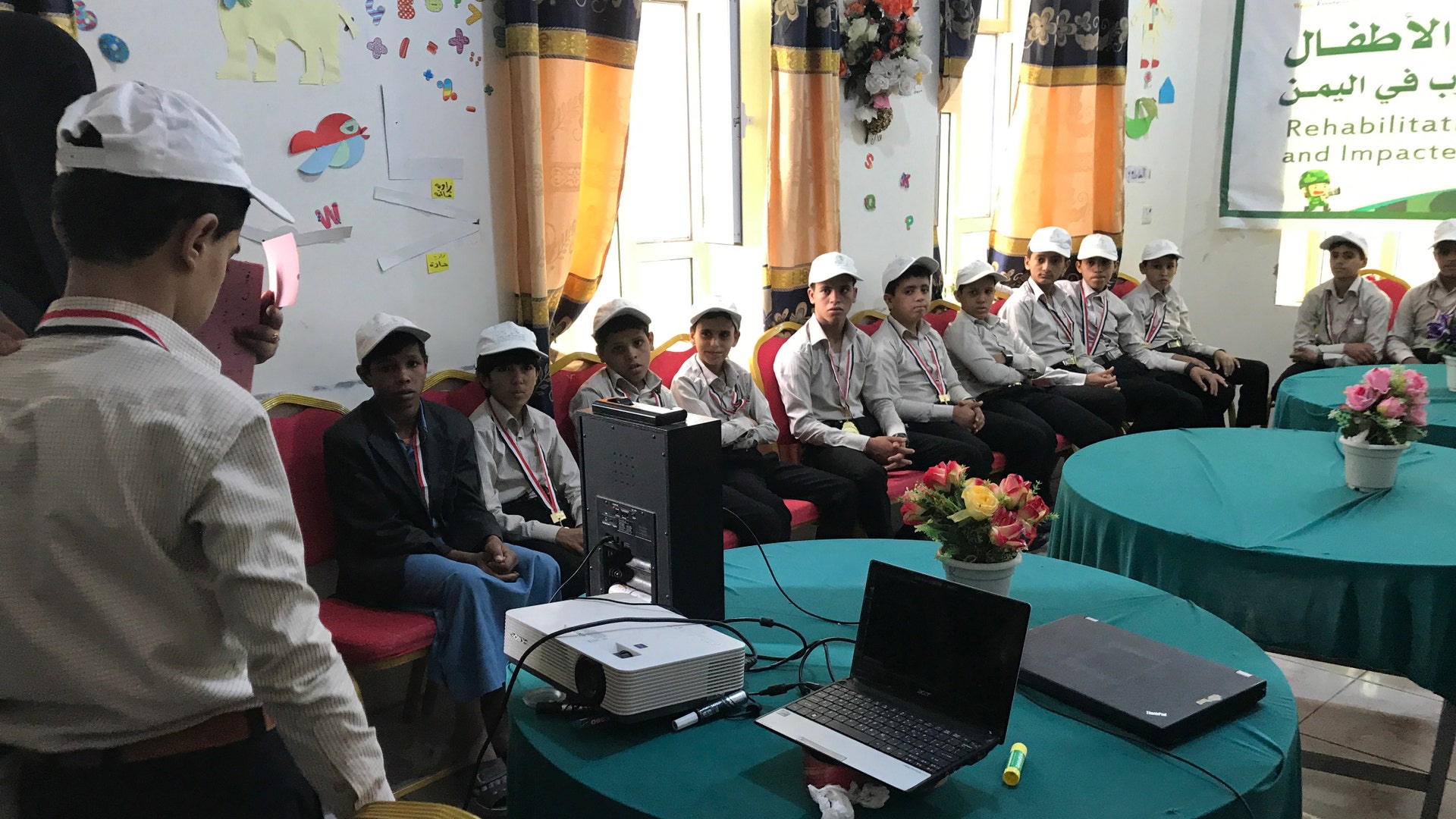 Children focus on a classmate during studies at the King Salman (KS) Humanitarian Aid and Relief Center in Yemen.