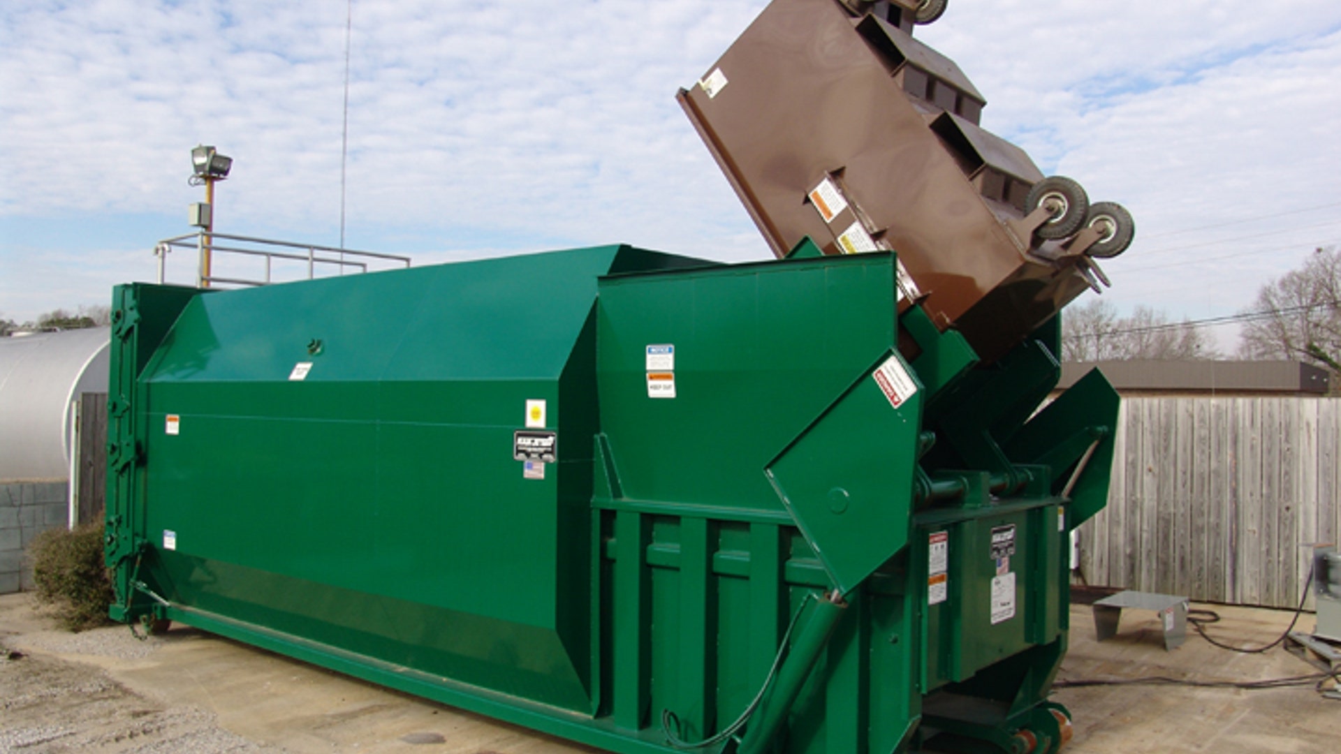 Trash compactor makes 10-foot logs