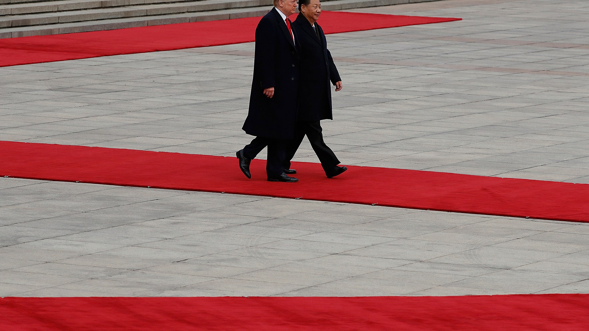 President Donald Trump and Chinese President Xi Jinping attend a welcoming ceremony at the Great Hall of the People in Beijing, Thursday