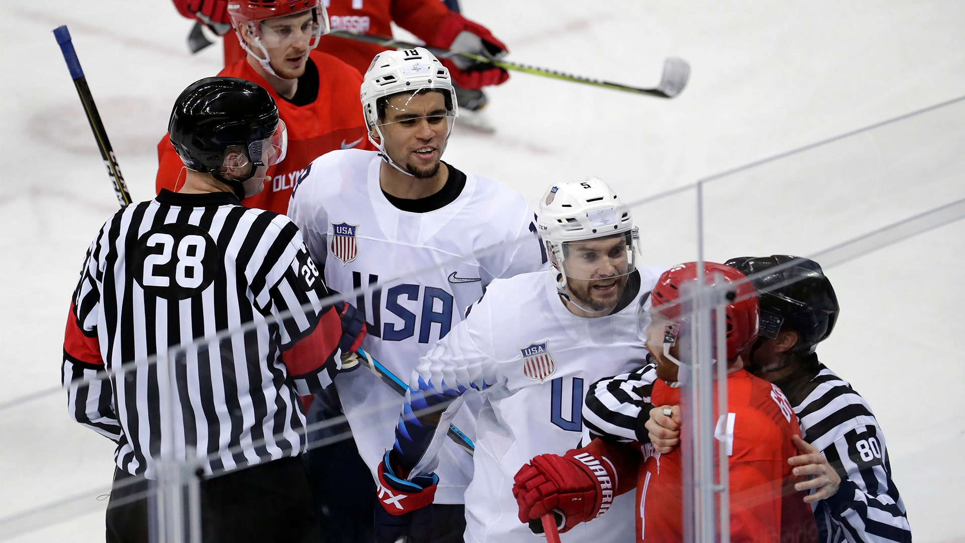 Referees break up a fight between Russian athlete Vladislav Gavrikov (4) and American Noah Welch (5)