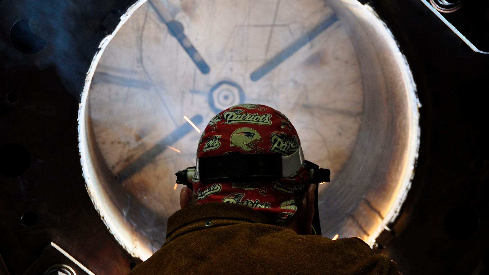Welder Albert Henson welds a submarine component in the structural shop