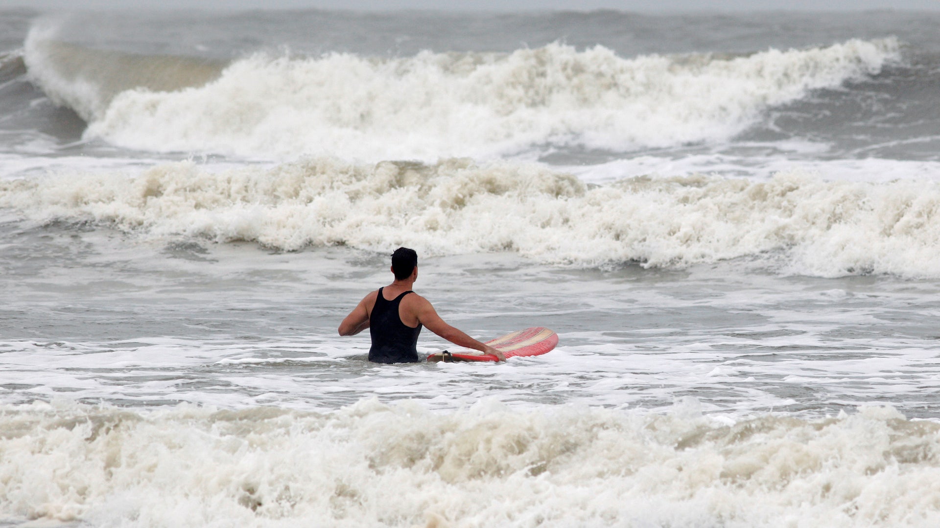 Surfer braves the swell