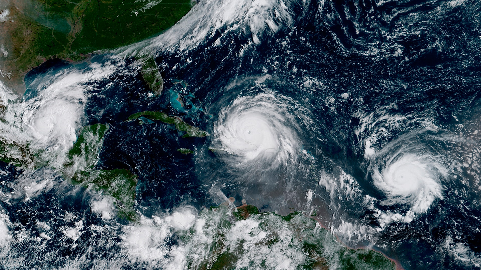  The eye of Hurricane Irma sits between Hurricane Katia, left, in the Gulf of Mexico, and Hurricane Jose, right on Thursday