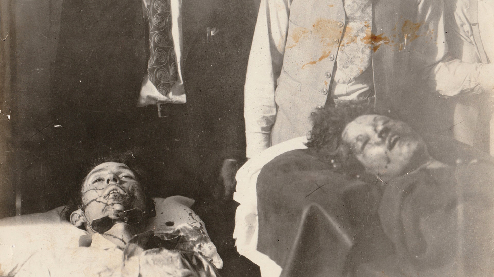 After their crime spree came to an end, their bodies were pulled through the city