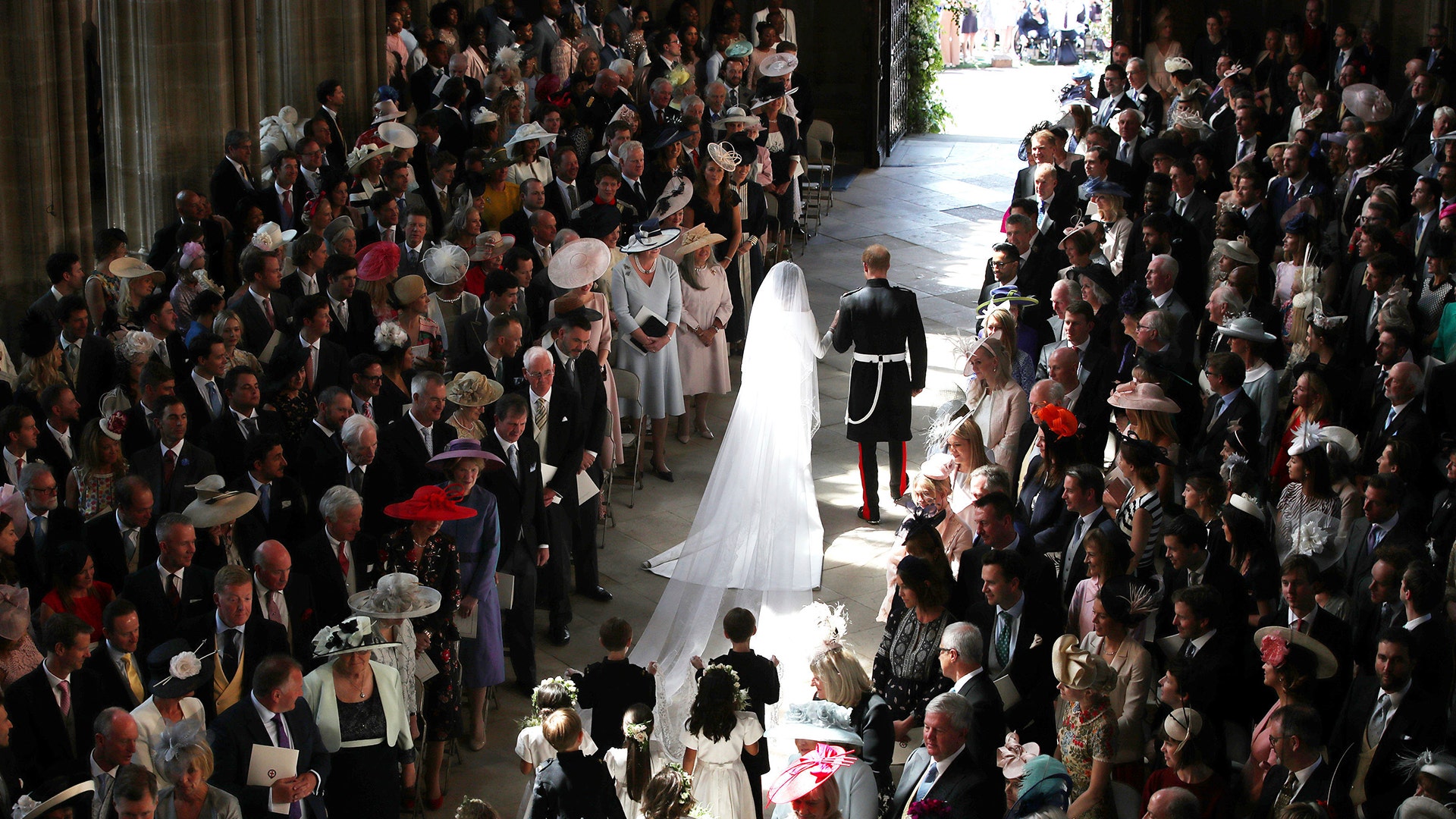 Prince Harry and Meghan Markle walk down the aisle after their wedding ceremony at St. George's Chapel in Windsor Castle