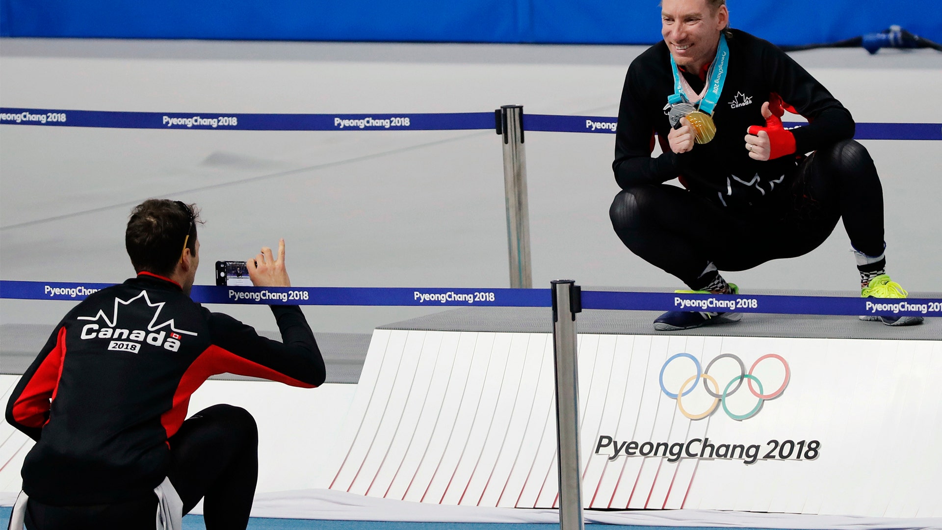 Ted-Jan Bloemen of Canada holds his gold medal as he poses for a picture on the podium 