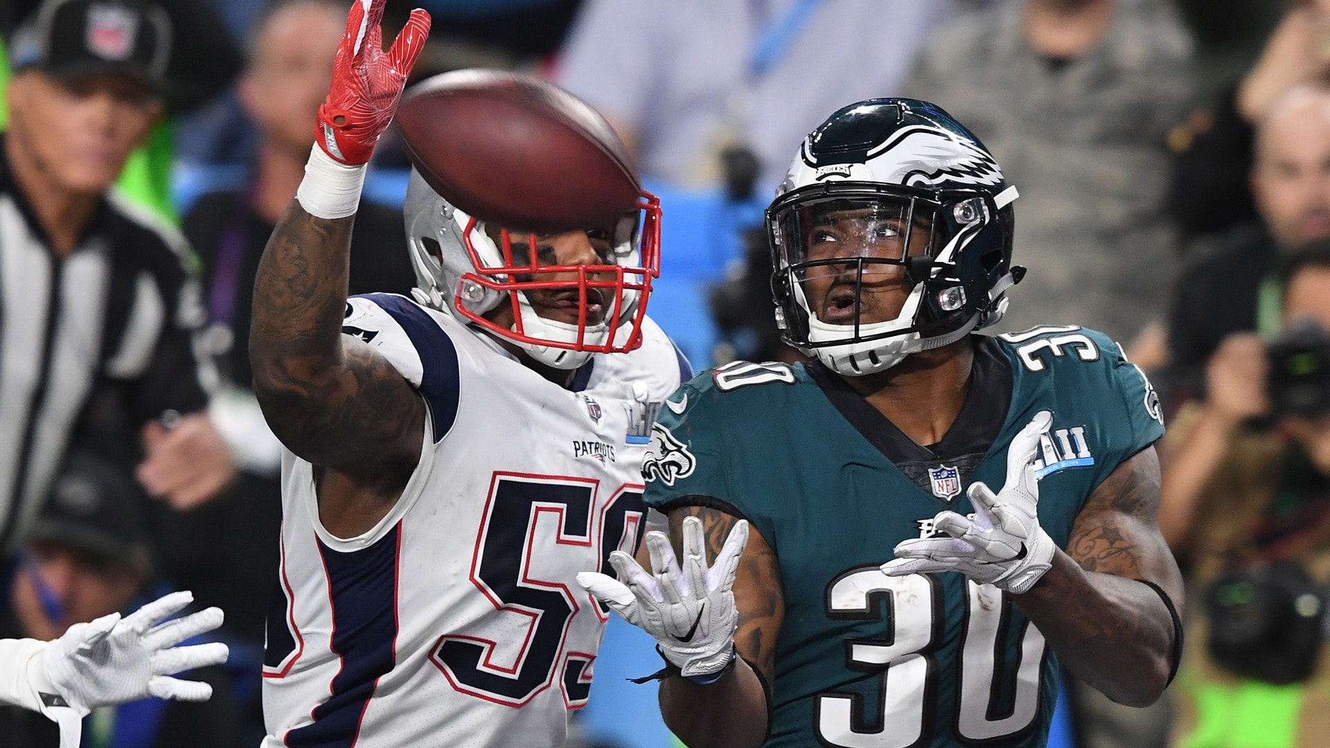 Philadelphia Eagles Corey Clement catches a touchdown pass in front of New England Patriots Marquis Flowers in Super Bowl 52