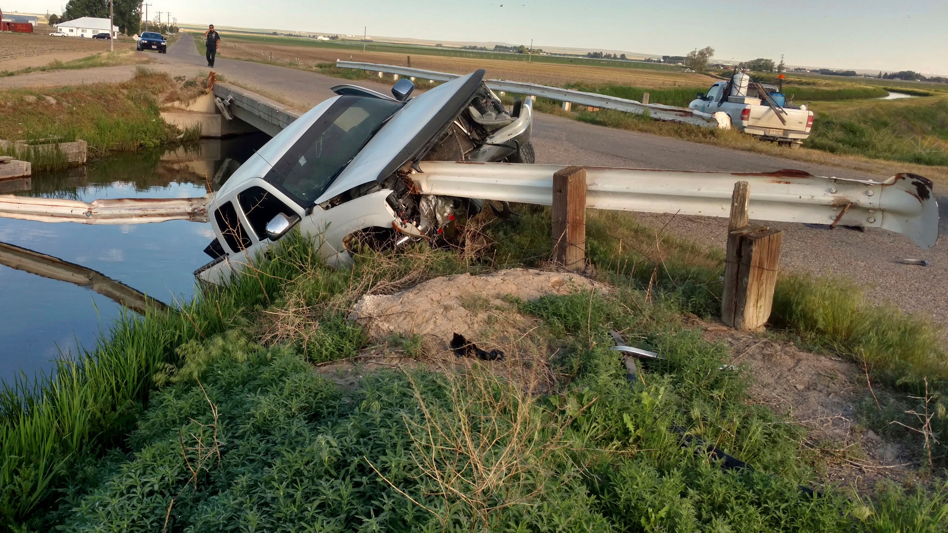 The pickup took out several yards of guard rail