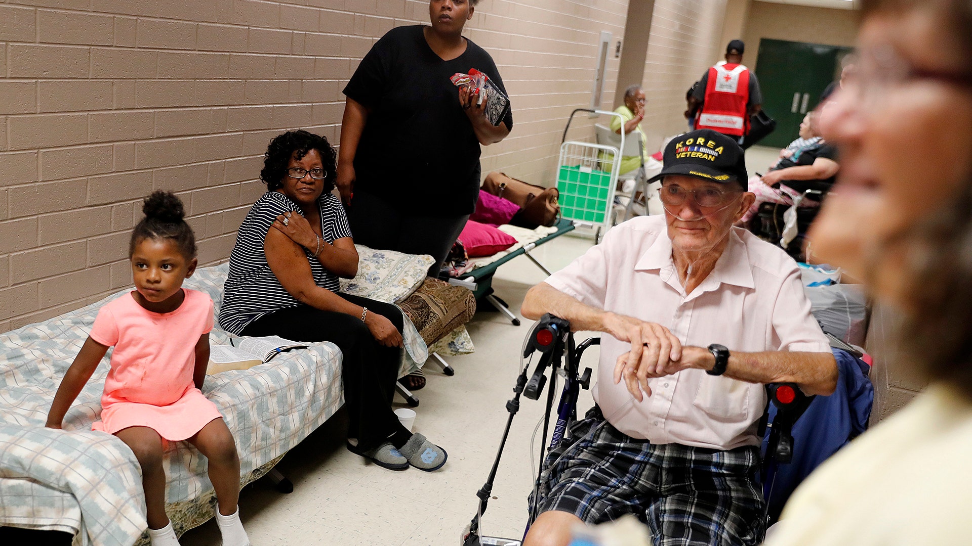 People arrive in a shelter for Hurricane Florence to pass after evacuating from their nearby homes in Conway, South Carolina, Wednesday