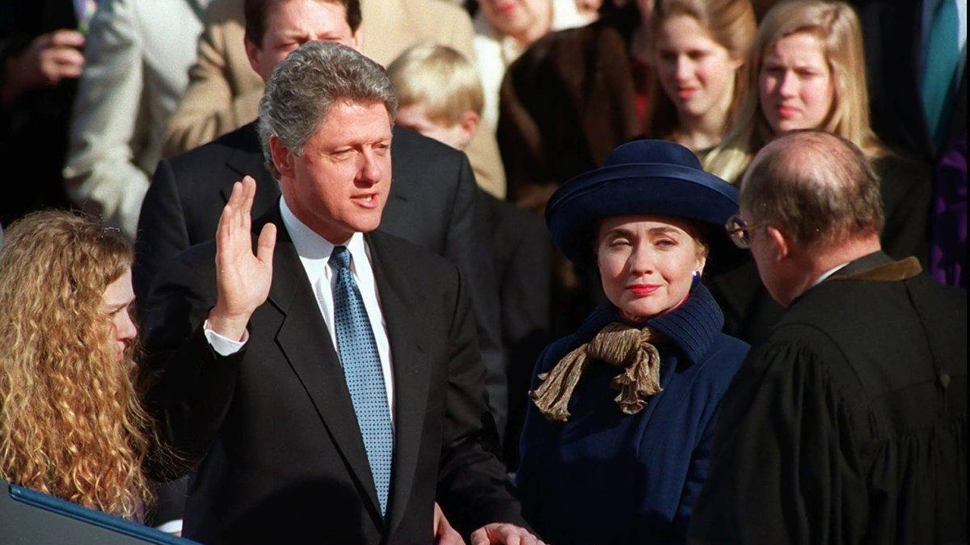 William Jefferson Clinton, with his wife Hillary Rodham Clinton and daughter Chelsea at his side, takes the oath of office as 42nd president of the United States from Chief Justice William H. Rehnquist on Jan. 20, 1993.