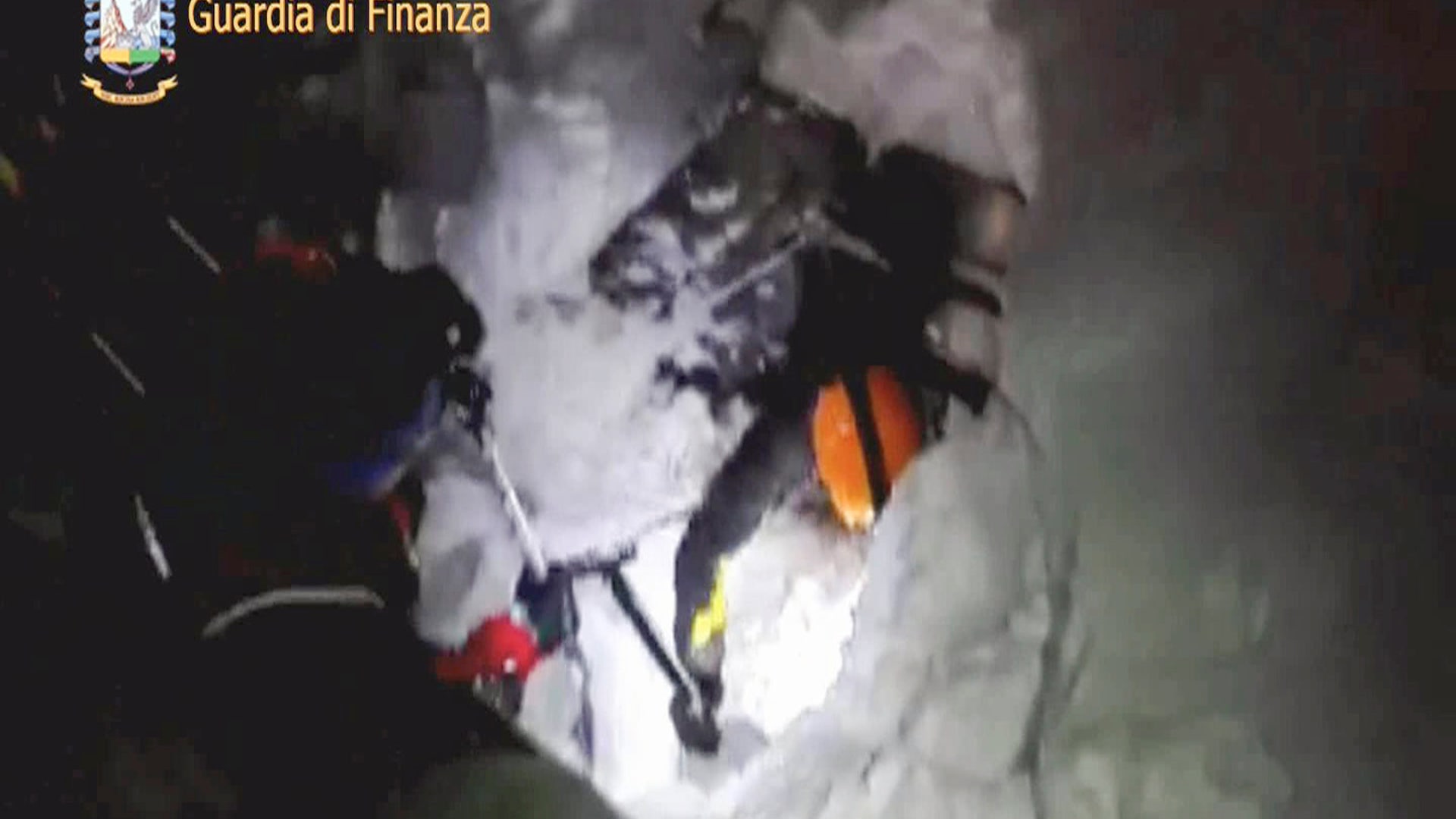 A photo taken from a video shows a rescuer entering the Hotel Rigopiano in Farindola. 
