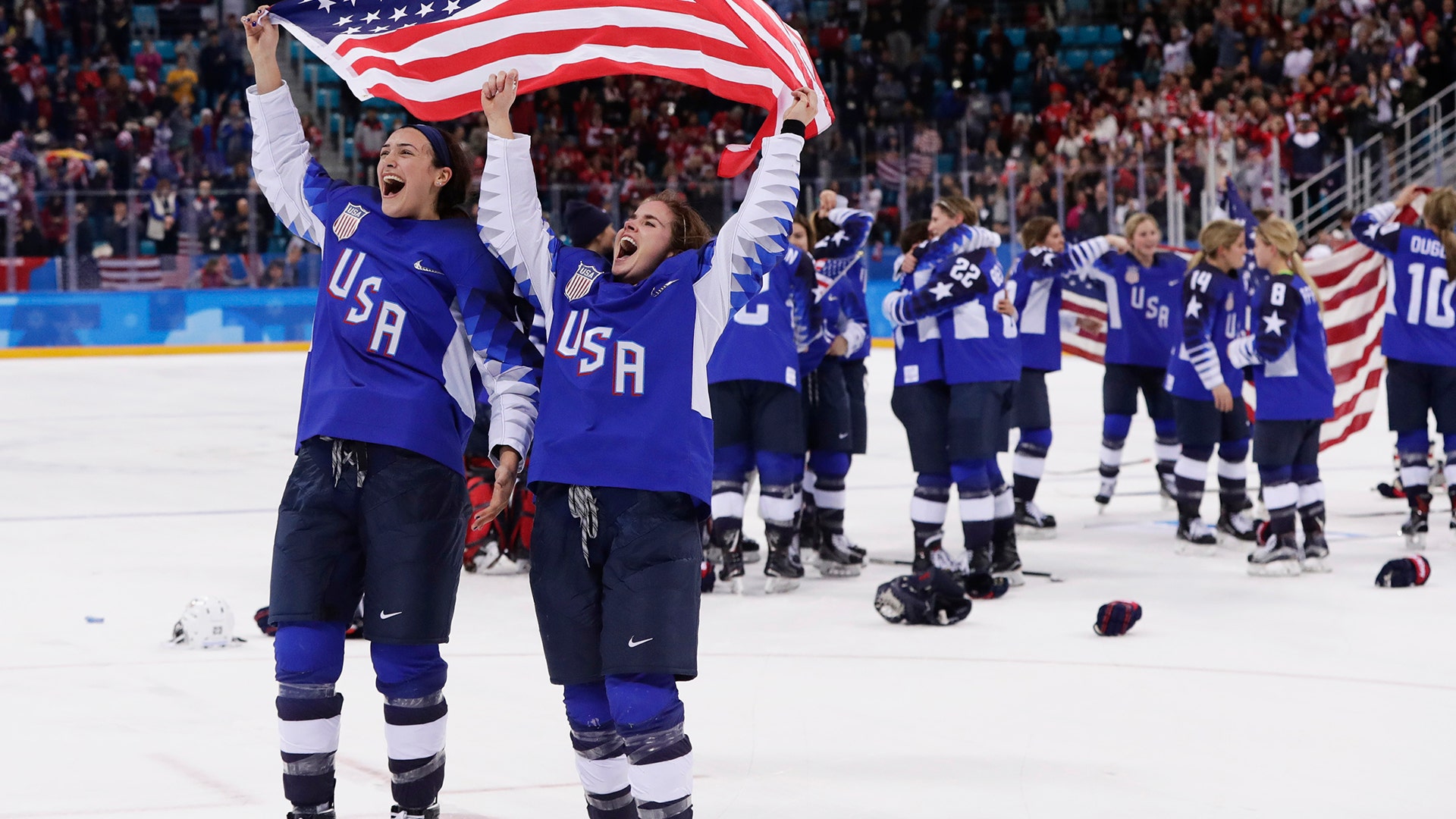 United States players celebrate after winning the women's gold medal hockey game against Canada at the 2018 Winter Olympics
