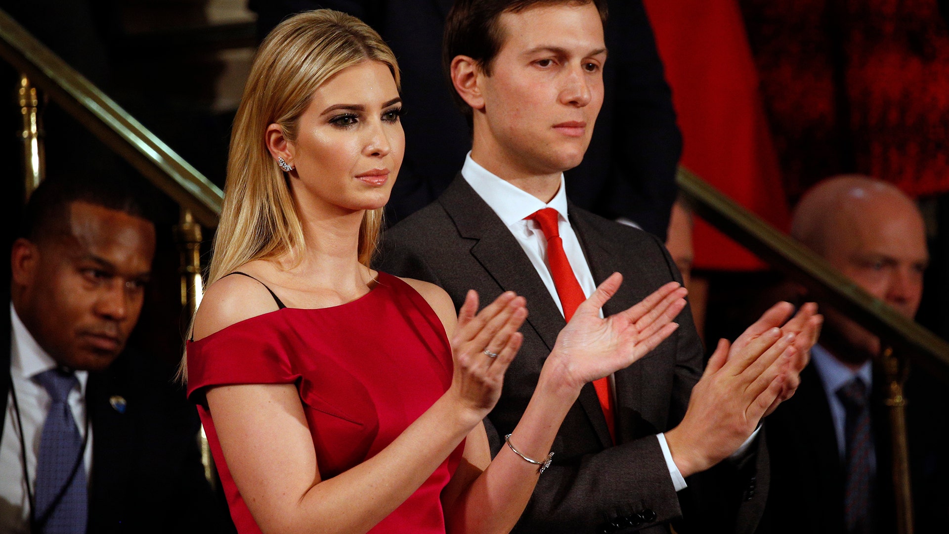 Ivanka Trump stands next to husband Jared Kushner as she cheers on her father. 
