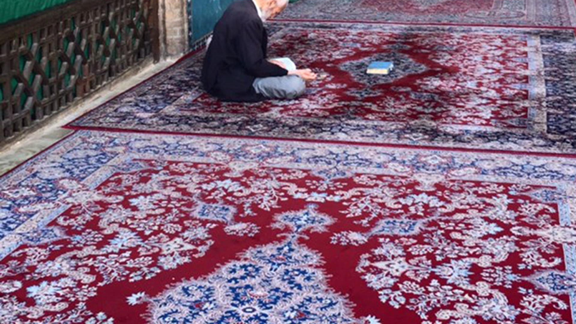 Man praying inside the ancient Jameh Mosque in Yazd