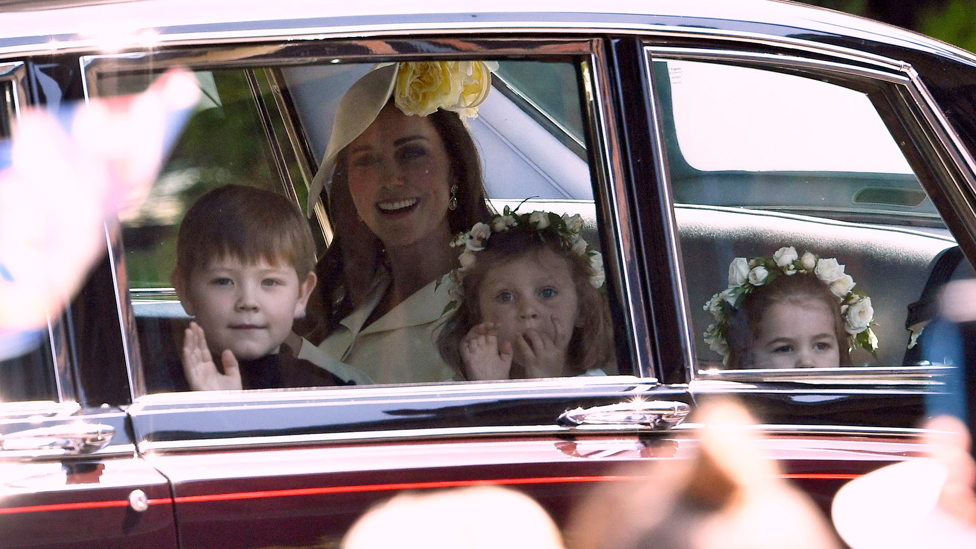 Kate, Duchess of Cambridge arrives with Princess Charlotte and bridesmaids for the wedding ceremony of Prince Harry and Meghan Markle
