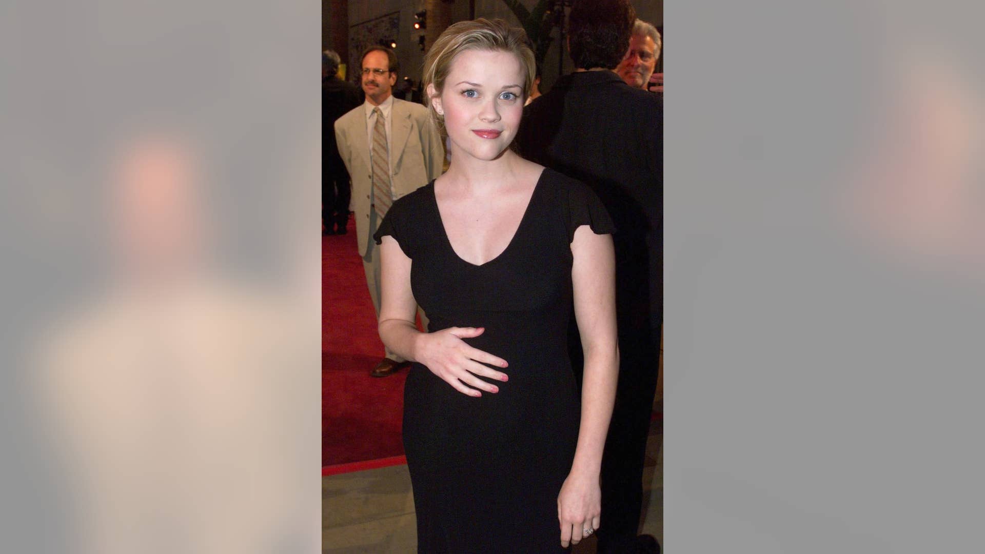 Pregnant with her first child, Ava (born September 9, 1999), Witherspoon arrived for the Hollywood premiere of "Election." In the film, a high school election goes awry when the student government adviser (Matthew Broderick) sabotages the campaign of an over-achieving high school student (Witherspoon) running for student body president. Her performance as Tracy Flick was ranked #45 on Premiere magazine's 100 Greatest Performances of All Time.