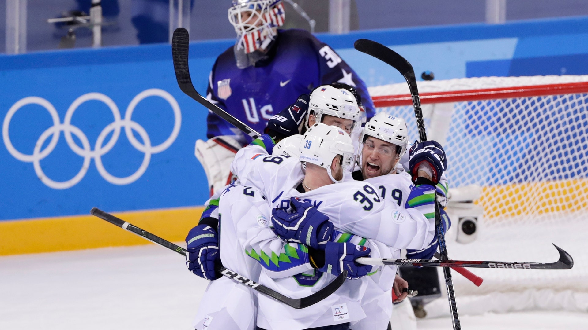  Slovenia players celebrate after scoring the game winning goal in overtime against the United States in ice hockey at the 2018 Winter Olympics