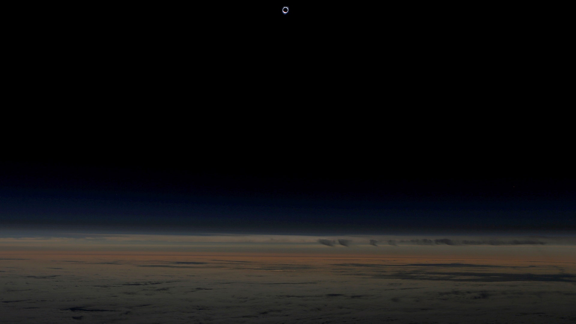 The solar eclipse as seen from an Alaska Airlines commercial jet at 40,000 feet above the Pacific Ocean off the coast of Depoe Bay, Oregon