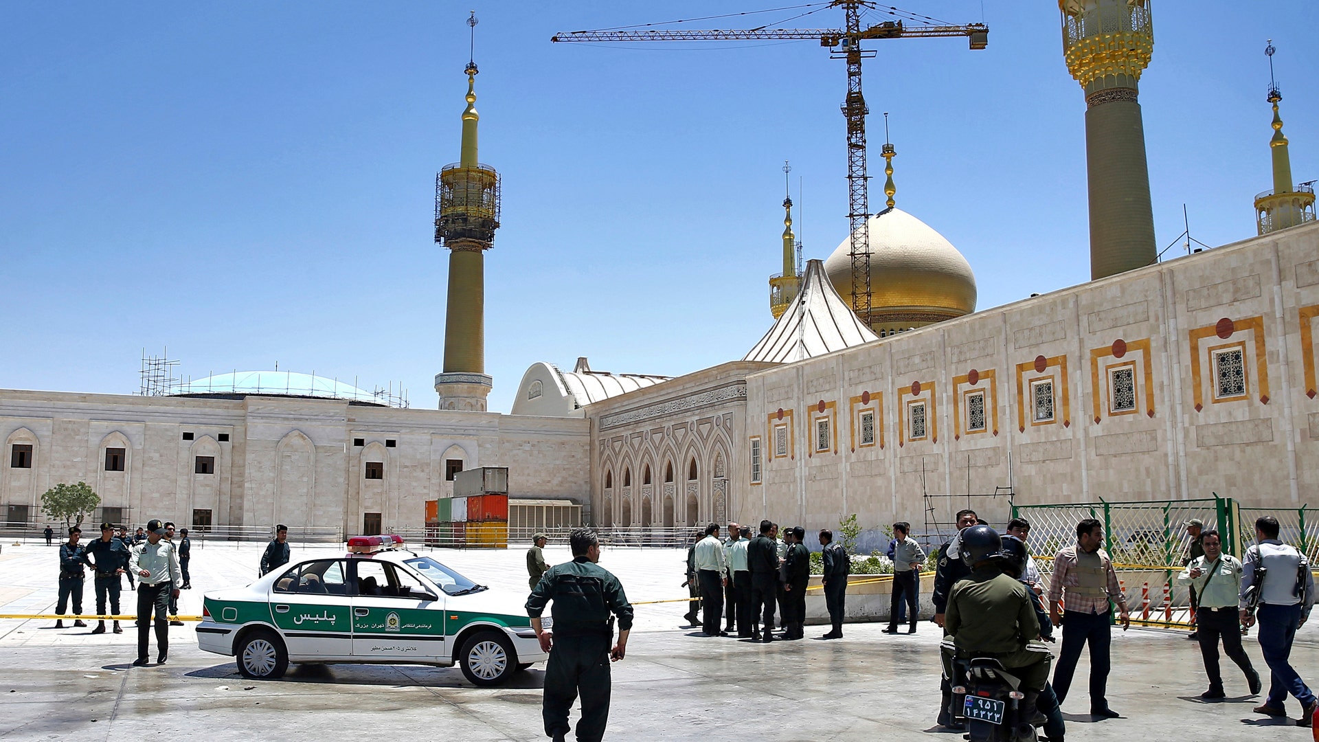 Police officers at the shrine of late Iranian revolutionary founder Ayatollah Khomeini, after an assault by several attackers