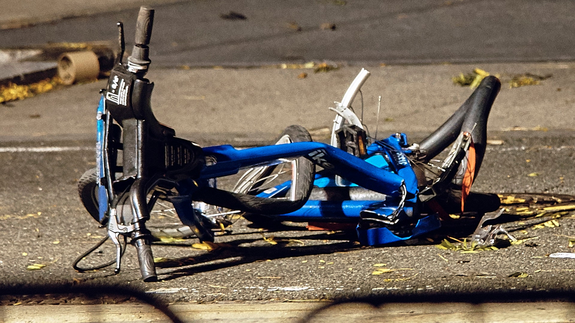 A mangled bicycle lies on the ground at the crime scene where a motorist drove onto a path killing eight people in New York City, October 31