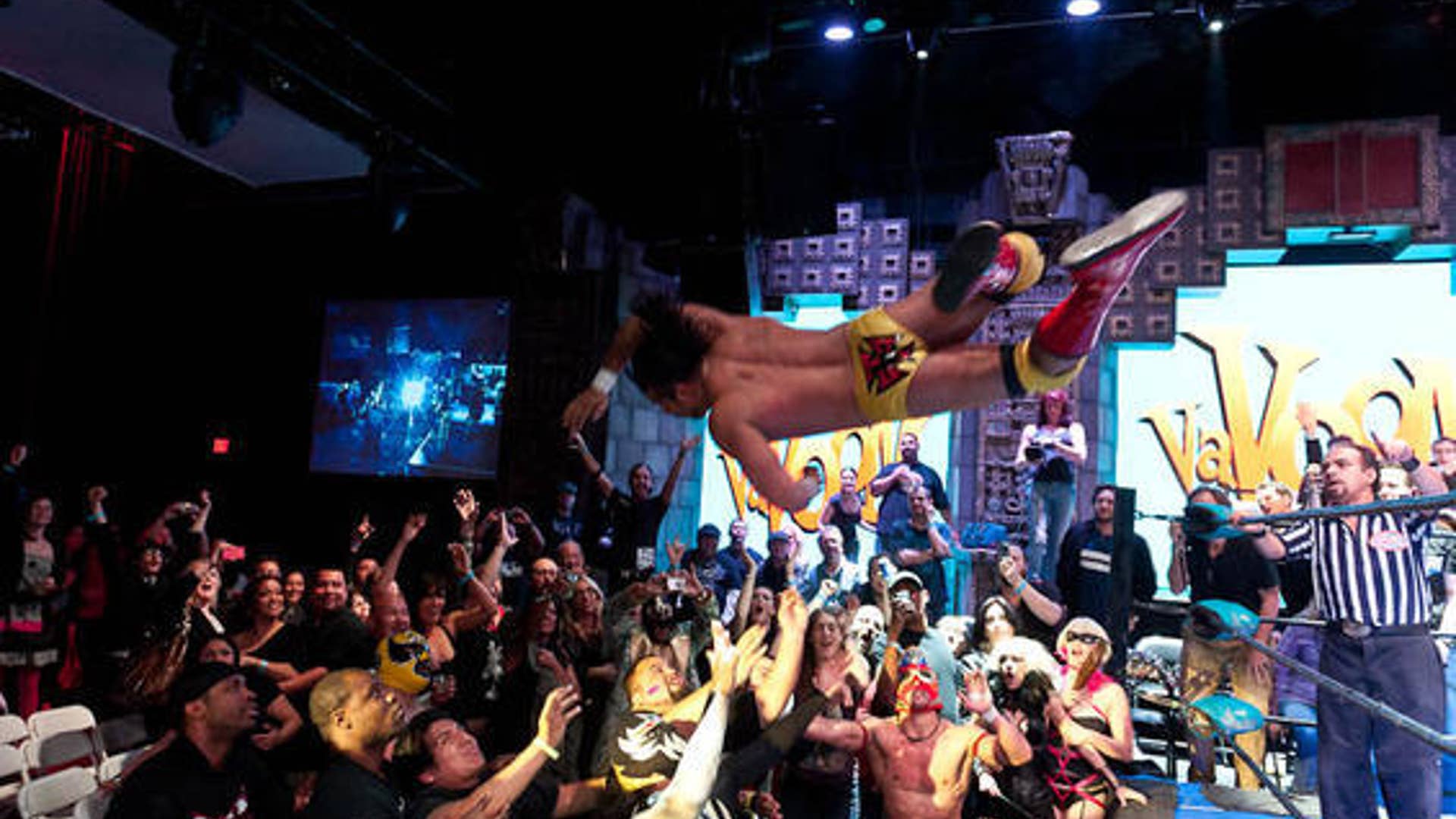 Lucha Va Voom crowd flying luchador