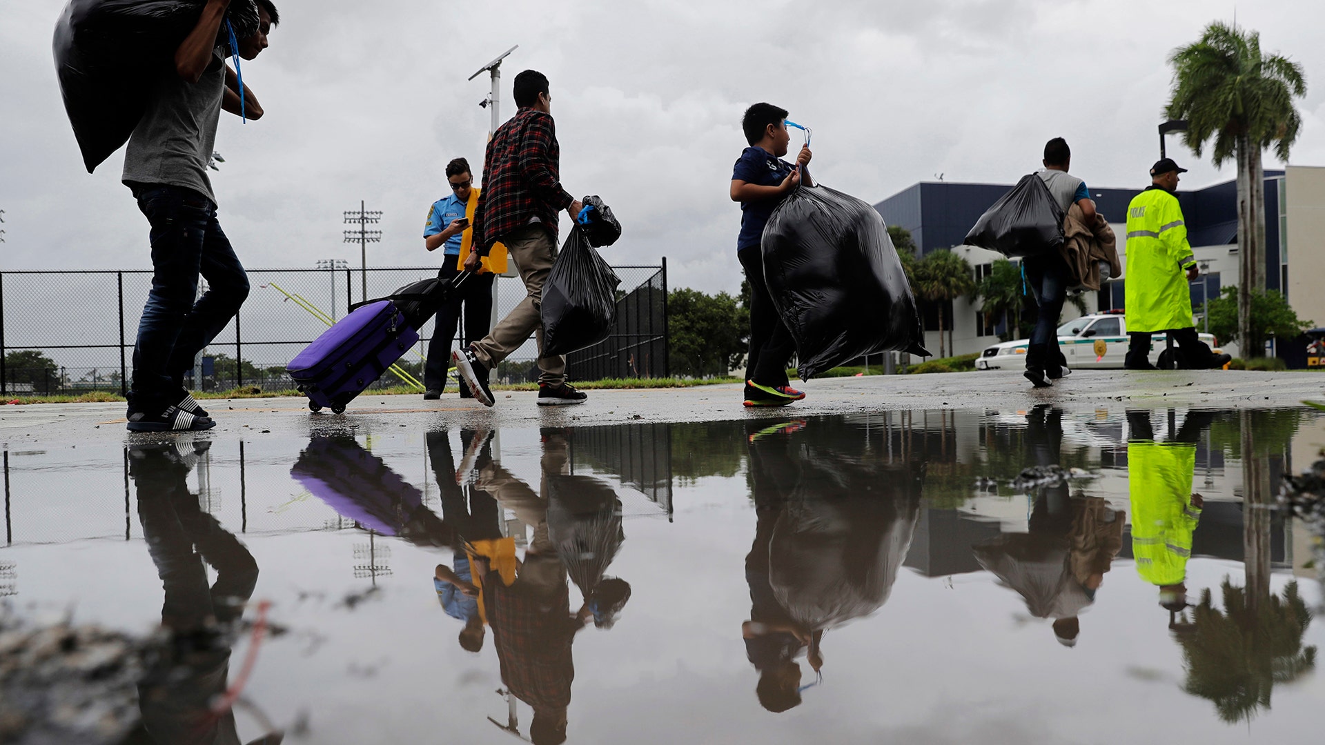 Evacuees are moved to another building with more bathrooms while sheltering at Florida International University