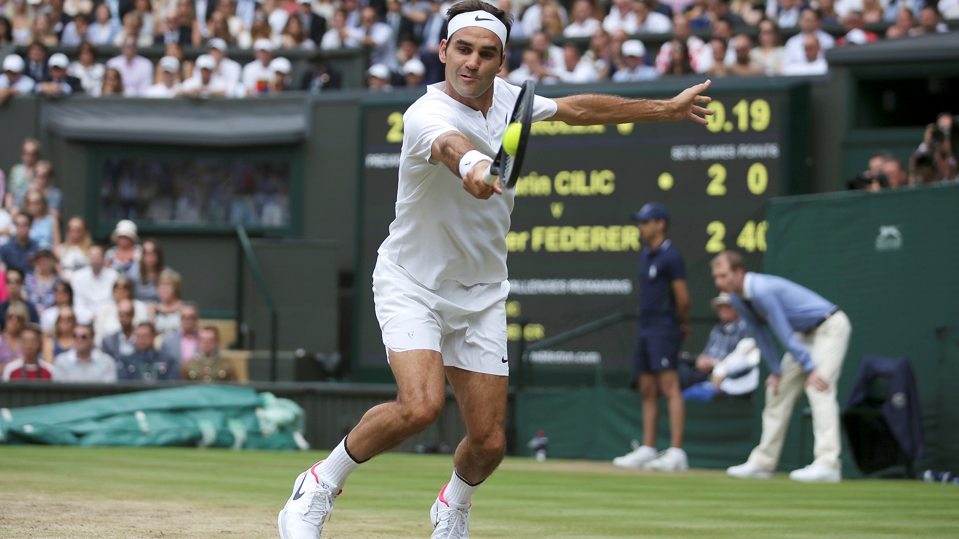 Switzerland’s Roger Federer hits a return during the men's Wimbledon final against Croatia’s Marin Cilic in London