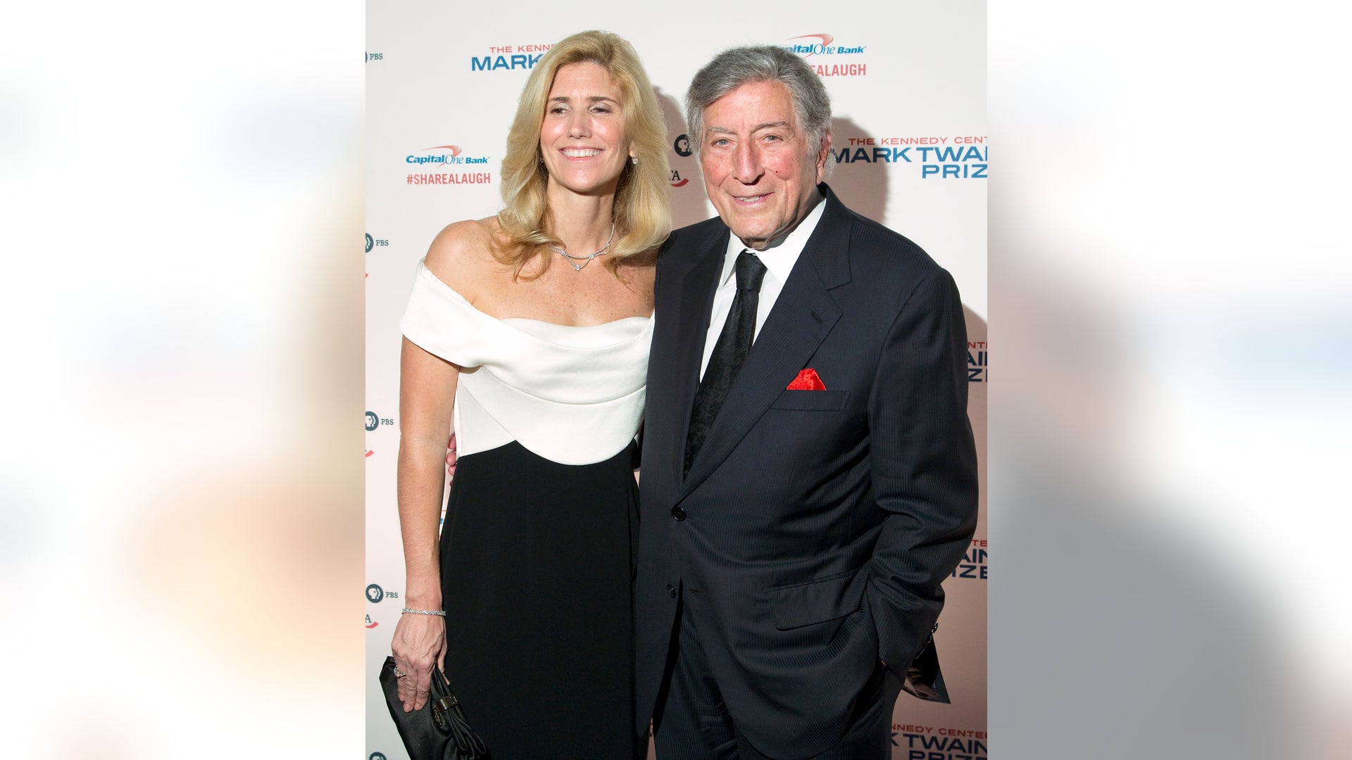 Singer Tony Bennett and his wife Susan Crow arrive on the red carpet before the 2013 Mark Twain Prize for American Humor presentation to Carol Burnett at the Kennedy Center in Washington, October 20, 2013. REUTERS/Jonathan Ernst (UNITED STATES - Tags: ENTERTAINMENT) - RTX14I8H